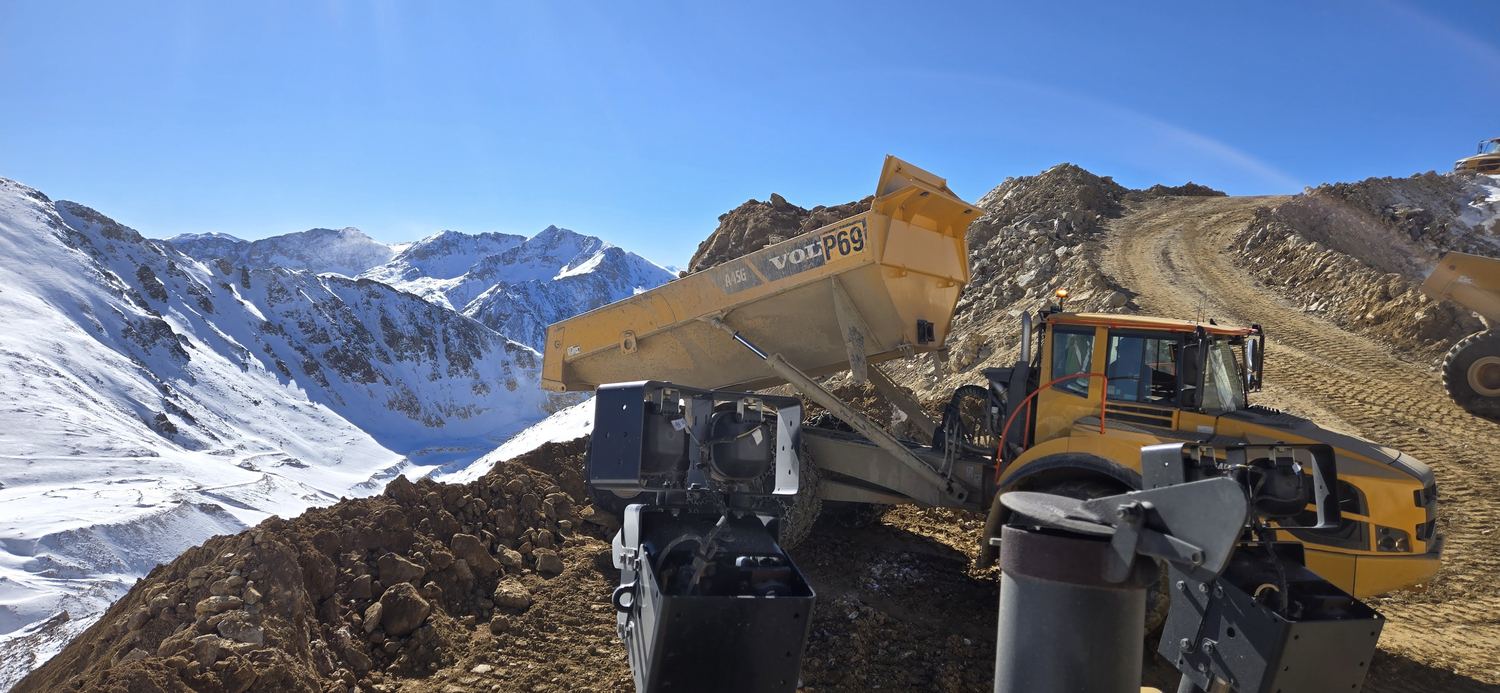 Volvo A45G articulated truck dumping a load at elevation.